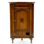 A VICTORIAN OAK CORNER CUPBOARD WITH PANELLED DOOR, ON LATER FEET, 128CM X 81CM W