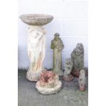 A composition stone bird bath, raised on a column decorated with the three graces, 77cm high,