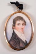 A portrait miniature of a gentleman in black coat and white stock, painted on ivory, circa 1810,