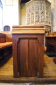 A Victorian pine pew with doubled paneled back and prayer book shelf to the reverse, 83cm high,