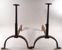 A pair of wrought iron fire dogs,