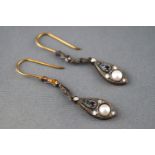 A yellow metal pair of drop earrings set with diamonds pearls and sapphires, hook fitting.