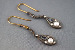 A yellow metal pair of drop earrings set with diamonds pearls and sapphires, hook fitting.