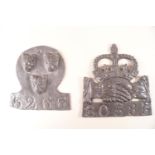 A pair of lead Fire Insurance plaques, one with three lion masks,