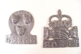 A pair of lead Fire Insurance plaques, one with three lion masks,