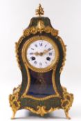 A Boulle clock, in the French 18th century bombe style, with green finish,