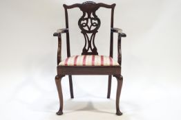 A child's mahogany Chippendale style carver with pierced and carved splat over a drop in seat