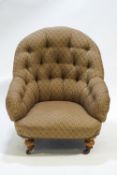 A Victorian nursing chair with button back on baluster turned legs