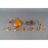 A collection of amber/silver jewellery