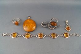 A collection of amber/silver jewellery