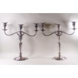 A pair of early 19th century Sheffield plate candlestick/three branch candelabra combinations on