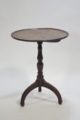 A Georgian mahogany tripod table of traditional form,