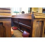 A Victorian pine pew with double paneled back and prayer book shelf to the reverse 83cm high,