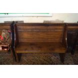 An oak pew with linen fold paneled side, 77cm high, 133.5cm wide,