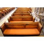 A Victorian pine pew with doubled paneled back and prayer book shelf to the reverse, 83cm high,