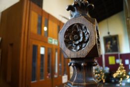 An oak and pine church pew screen with carved final pierced and plank back with seven gothic