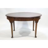 A mahogany extending dining table on four cabriole legs, by Sharpe of Leicester,