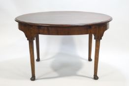 A mahogany extending dining table on four cabriole legs, by Sharpe of Leicester,