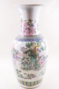 A 20th century Chinese porcelain vase painted in coloured enamels with figures in a landscape,