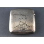 A silver vesta case of square form, engraved with a portrait of a gentleman in Victorian clothes,