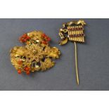 A yellow metal filigree floral brooch with coral beads together with an abstract section of brooch,