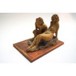Ron Olley, a stoneware group of two seated female nudes,