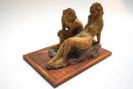 Ron Olley, a stoneware group of two seated female nudes,