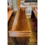 A Victorian pine pew with triple paneled back and prayer book shelf to the reverse (drilled hole)