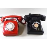 An A E P black dial telephone and a red bakelite dial telephone,