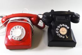 An A E P black dial telephone and a red bakelite dial telephone,
