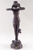 A bronze figure of a standing nymph,