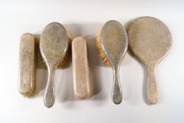 A five piece shagreen backed dressing table set