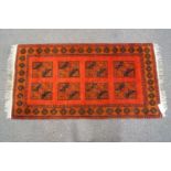 A terracotta ground Asian carpet,
