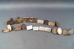 A collection of six pairs of silver cufflinks of various designs.