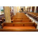 A Victorian pine pew with triple paneled back and prayer book shelf to the reverse 83cm high,