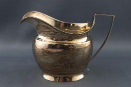 A silver milk jug of plain bevelled form on splayed foot, London 1806, 9cm high,