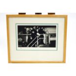 The Beatles, 16 x 12, Limited edition photograph, 30/49, of the group boarding a plane,