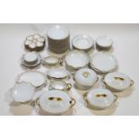 An extensive Limoges dinner service with gilt rims, together with eight Limoges oyster plates,