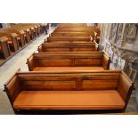 A Victorian pine pew with double paneled back and prayer book shelf to the reverse (drilled hole)