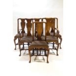 A set of six mahogany dining chairs on cabriole legs with turned stretchers