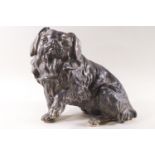 A Spelter figure of a seated Pekinese dog,