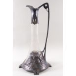 A Continental cut glass pewter mounted claret jug in the art nouveau style with flowers,