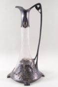 A Continental cut glass pewter mounted claret jug in the art nouveau style with flowers,