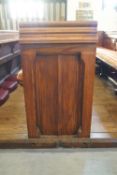 A Victorian pine pew with triple paneled back and prayer book shelf to reverse 83cm high,