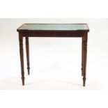 A Regency mahogany veneered rectangular writing table with brass set corners,