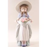 Lladro 6756, 'Bountiful Blossoms', a girl holding a basket of flowers,