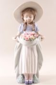 Lladro 6756, 'Bountiful Blossoms', a girl holding a basket of flowers,