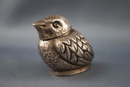 A white metal pepperette in the form of a chick, the base struck with Chinese marks,