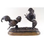 A bronze figural group of fighting cockerels, signed Mene,