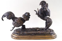 A bronze figural group of fighting cockerels, signed Mene,